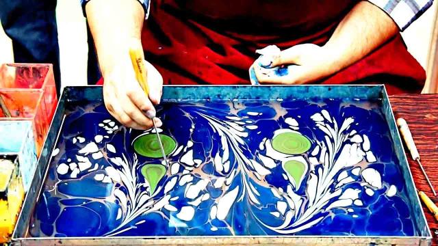 If painting on the water sounds impossible, you should watch this video